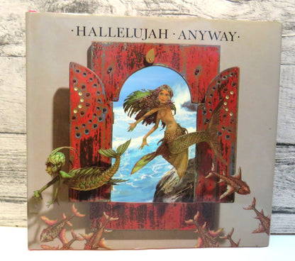 Hallelujah Anyway, A collection of Illustrated Lyrics by Patrick Woodroffe (Art Book, 1984) book front cover